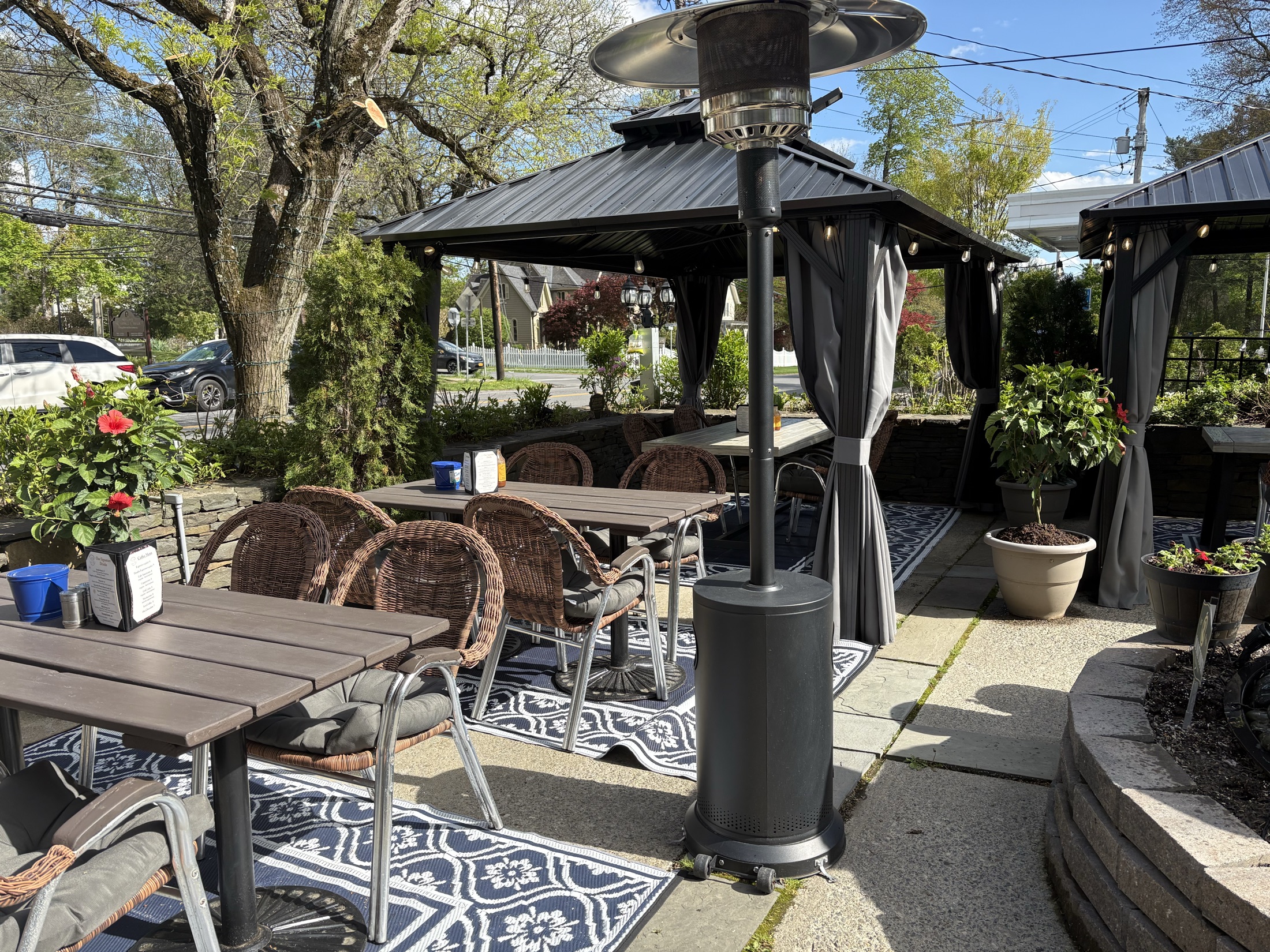 Smoky Rock BBQ patio seating with updated canopies, flowers, and shade