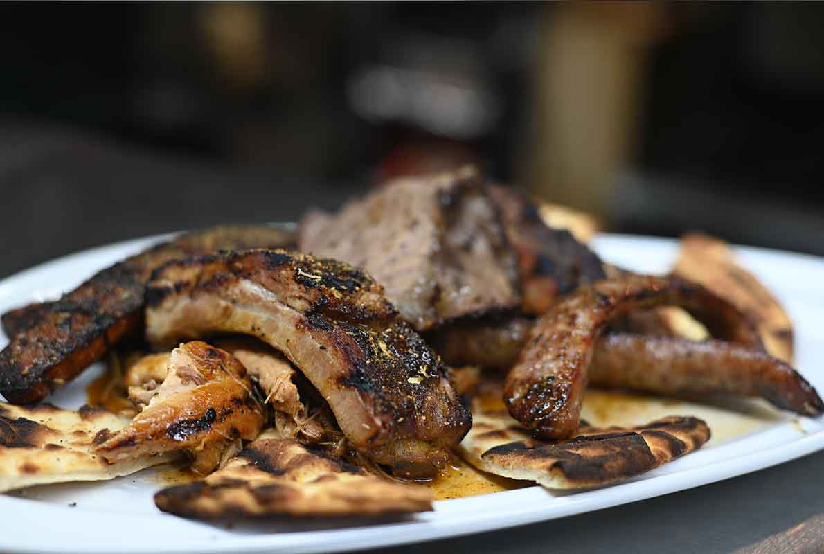 Smoky Rock BBQ sampler with smoked meats and starters