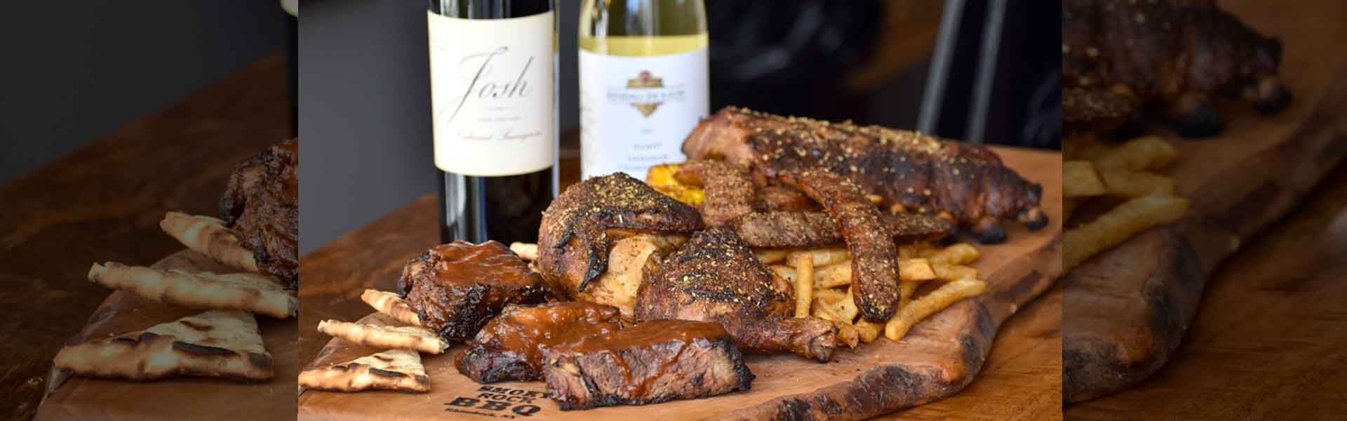 Smoky Rock BBQ combo platter with ribs and smoked meats