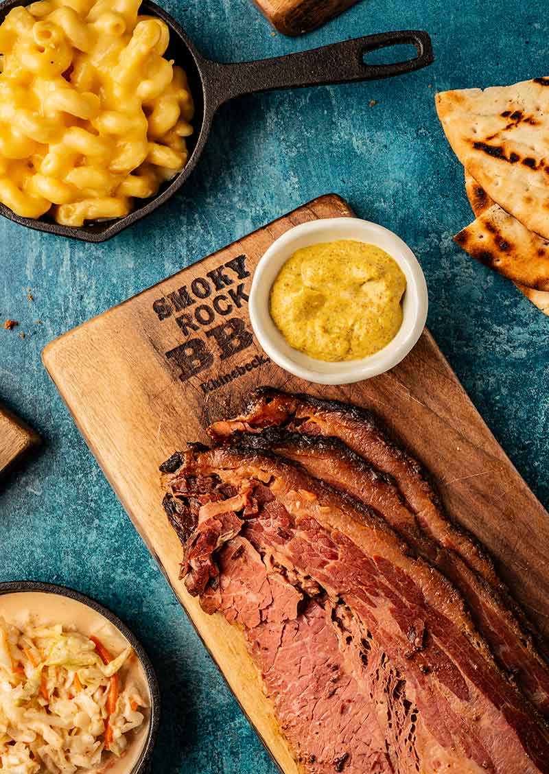 Smoky Rock BBQ brisket board with mac and slaw