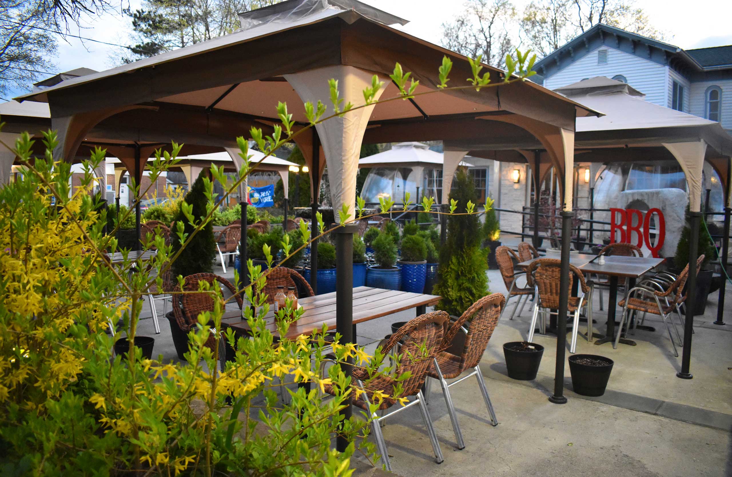 Smokehouse patio with guests and dining tables